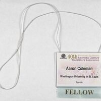  A nametag for the "American Literary Translators Association" including among other details a ribbon noting fellowship. 